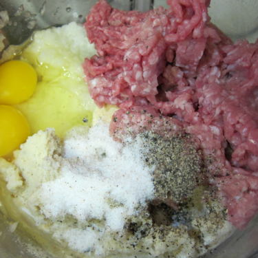 All the ingredients for meatballs in a bowl, ready to mix!