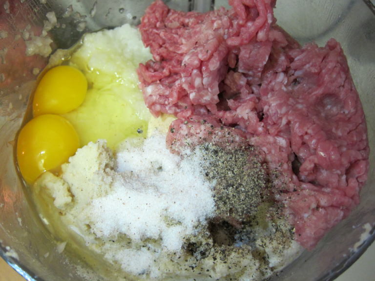 All the ingredients for meatballs in a bowl, ready to mix!