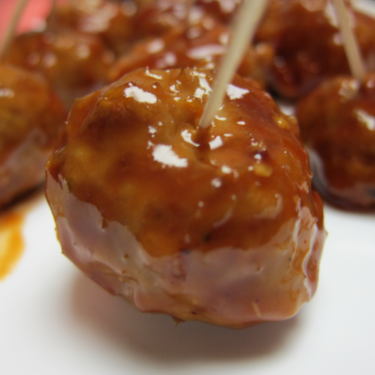 A shiny honey garlic cocktail meatball.