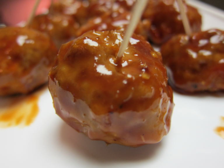 A shiny honey garlic cocktail meatball.